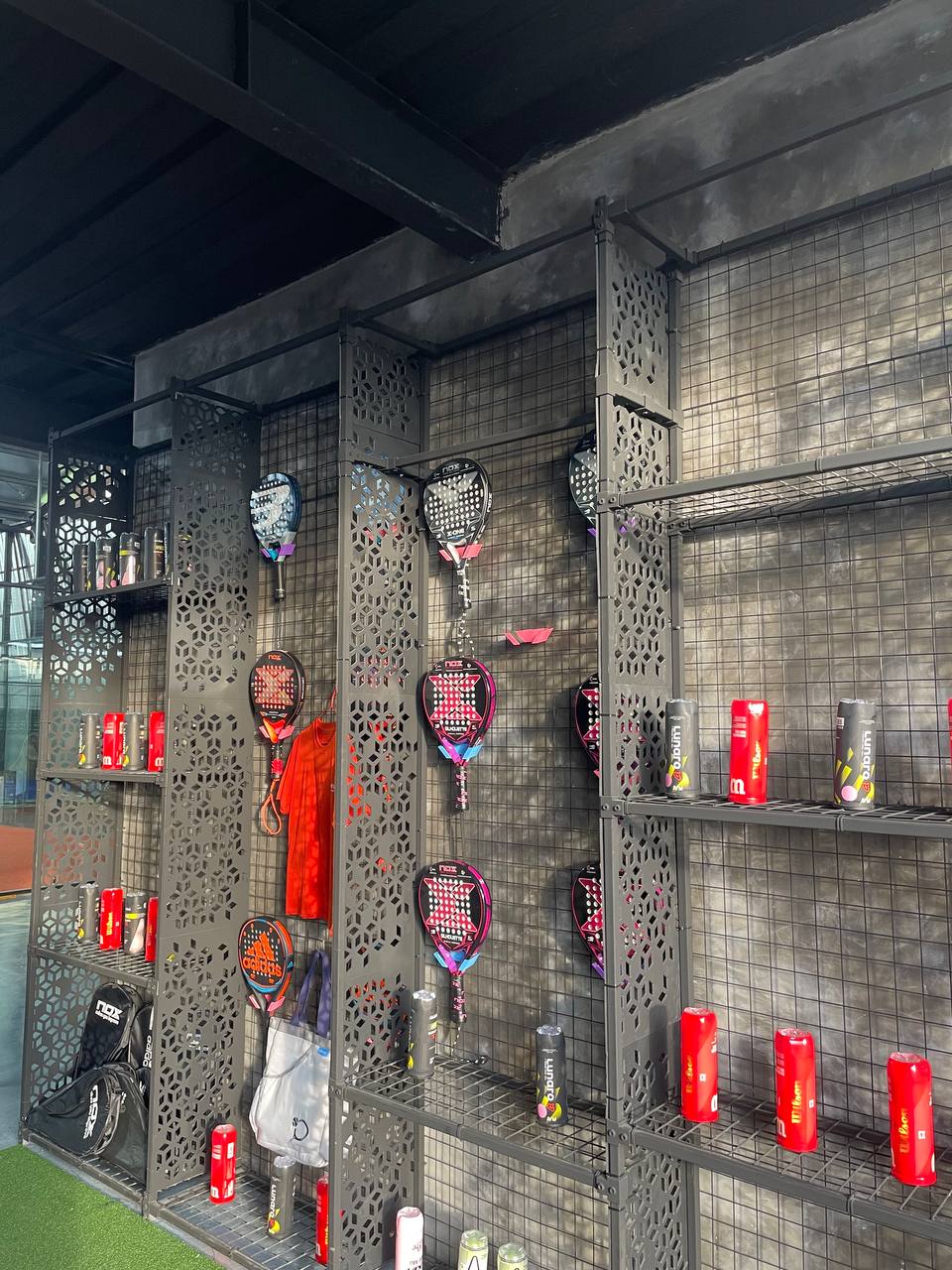LESSGO Padel rackets and gear wall